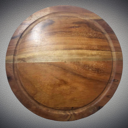 Large Round Wooden Cutting Board 12" diameter      Care instructions:  Hand Wash thoroughly before and after use.  Avoid abrasive cleaners.  Do not use over open flame.  Avoid cross-contamination of all food prep equipment.  Do not soak in water or exposed to heat or sunlight.  Wash with running water and dry after use.  Not for use in a microwave or dishwasher. 